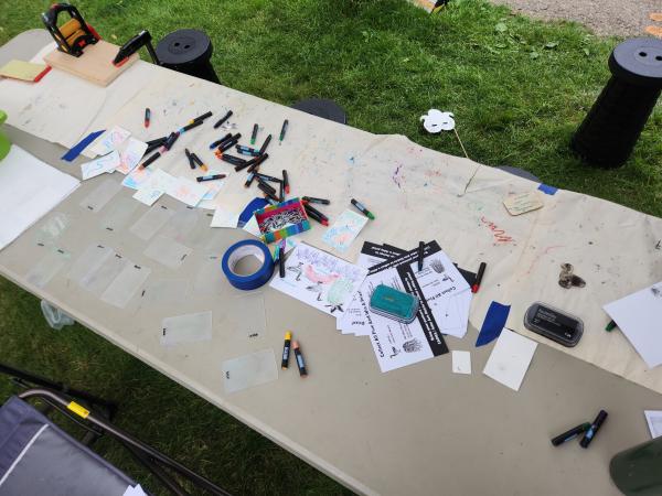 art materials scattered over table